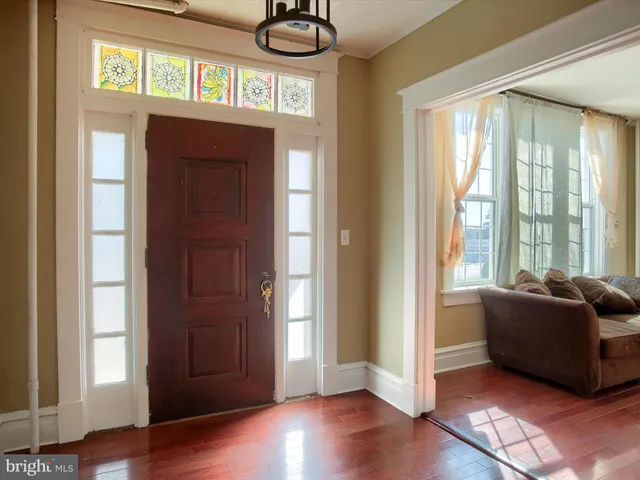 a living room with furniture or fireplace and a wooden floor