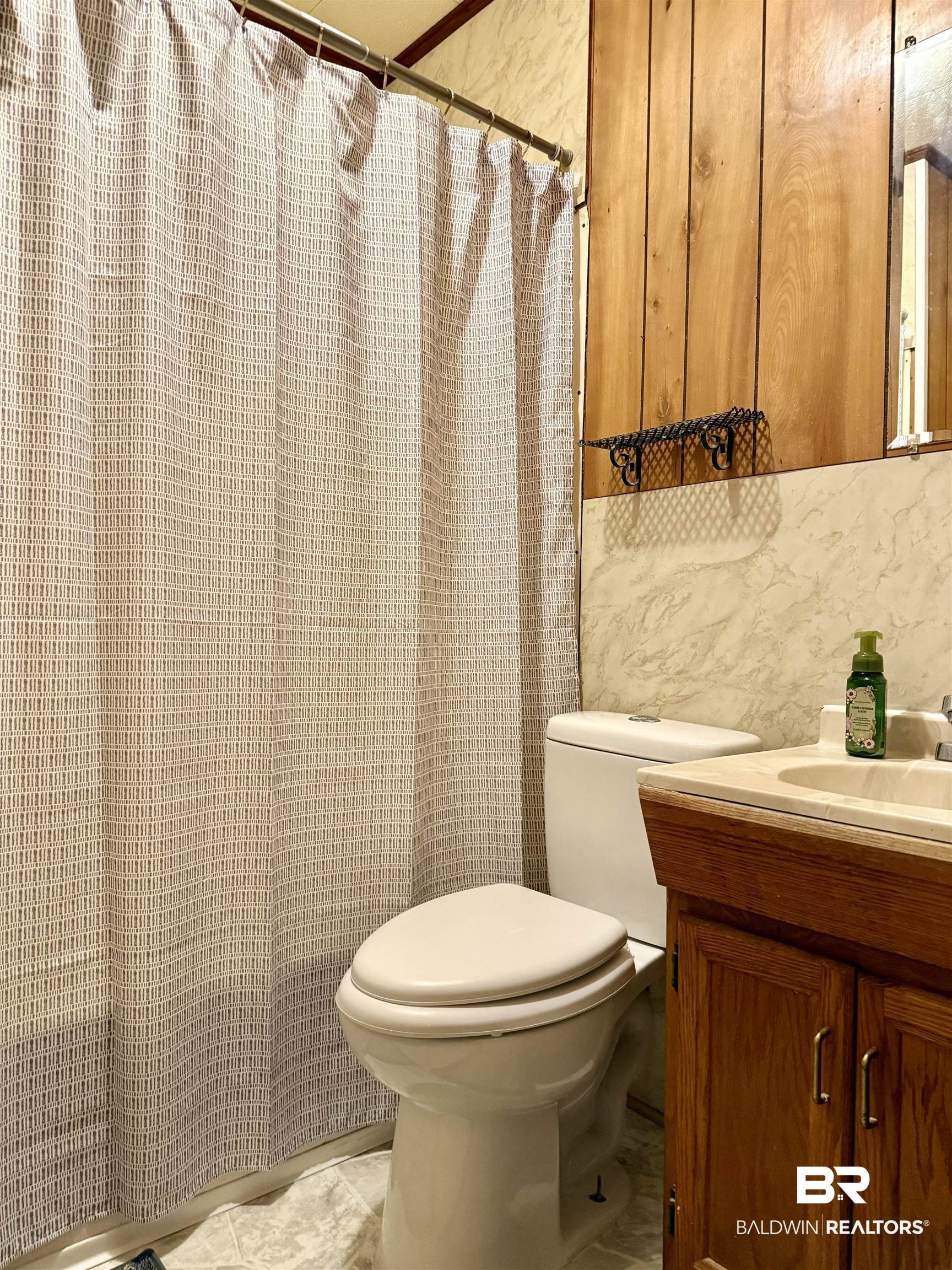 826 West Side Road Castleberry, AL 36432 - Photo 20 of 34 Bathroom featuring vanity, tile walls, and a shower with shower curtain