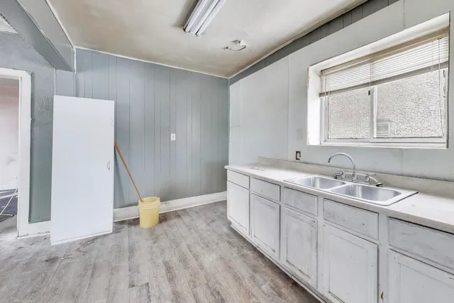 a bathroom with a sink and a large mirror