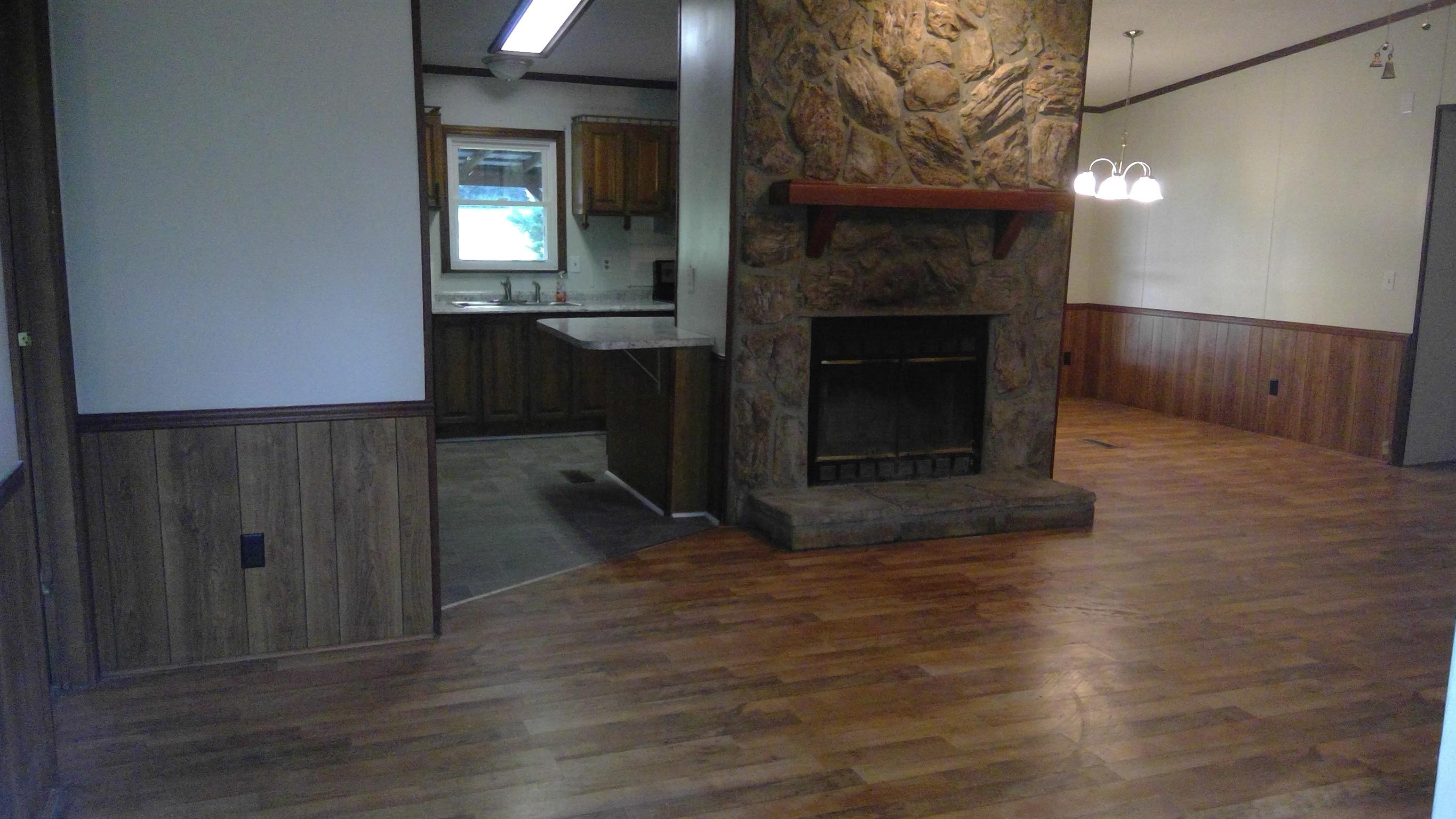 650 Canaan Road Columbia, TN 38401 - Photo 4 of 12 a view of a livingroom with a fireplace