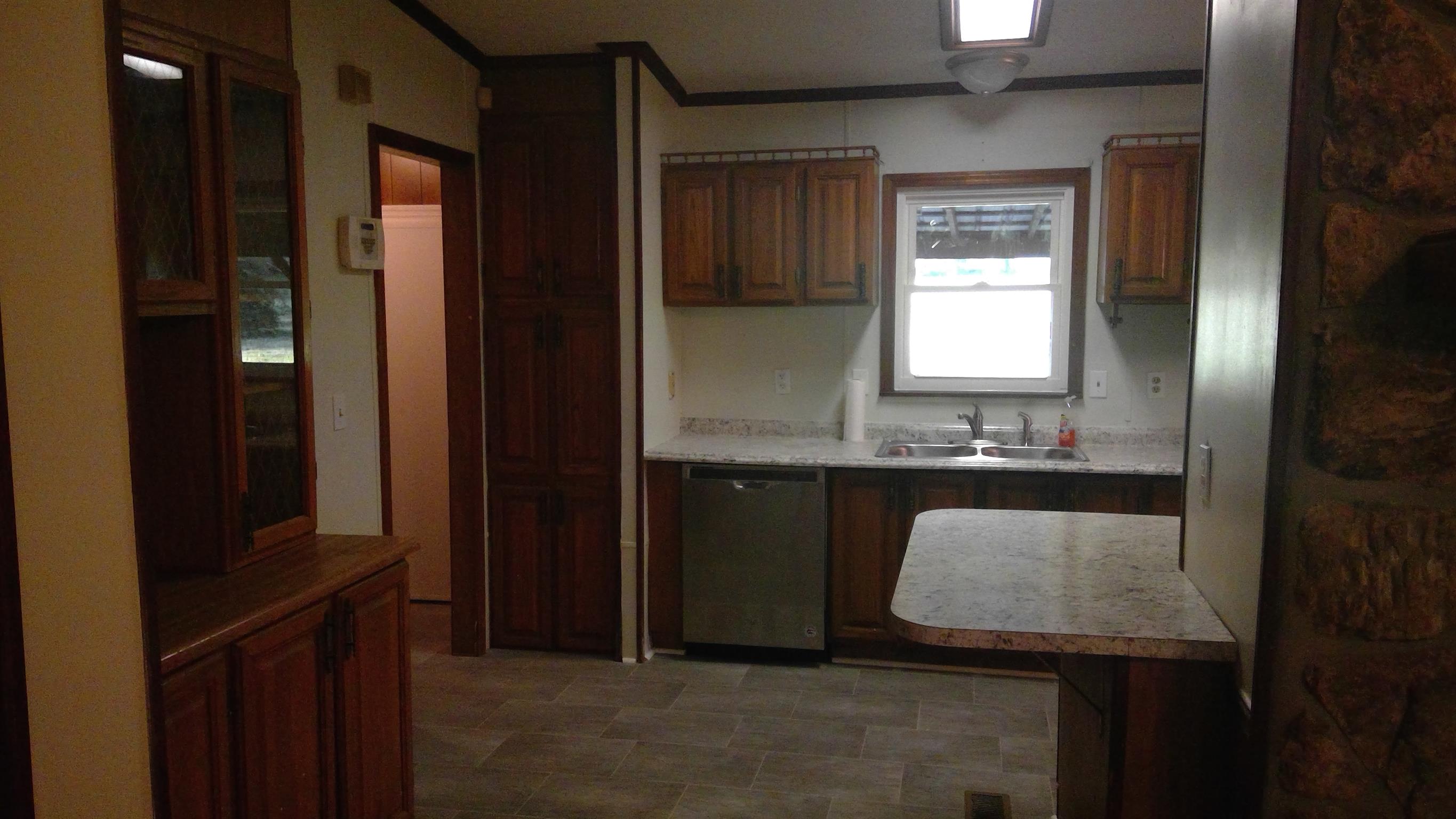 650 Canaan Road Columbia, TN 38401 - Photo 5 of 12 a bathroom with a granite countertop sink and a mirror