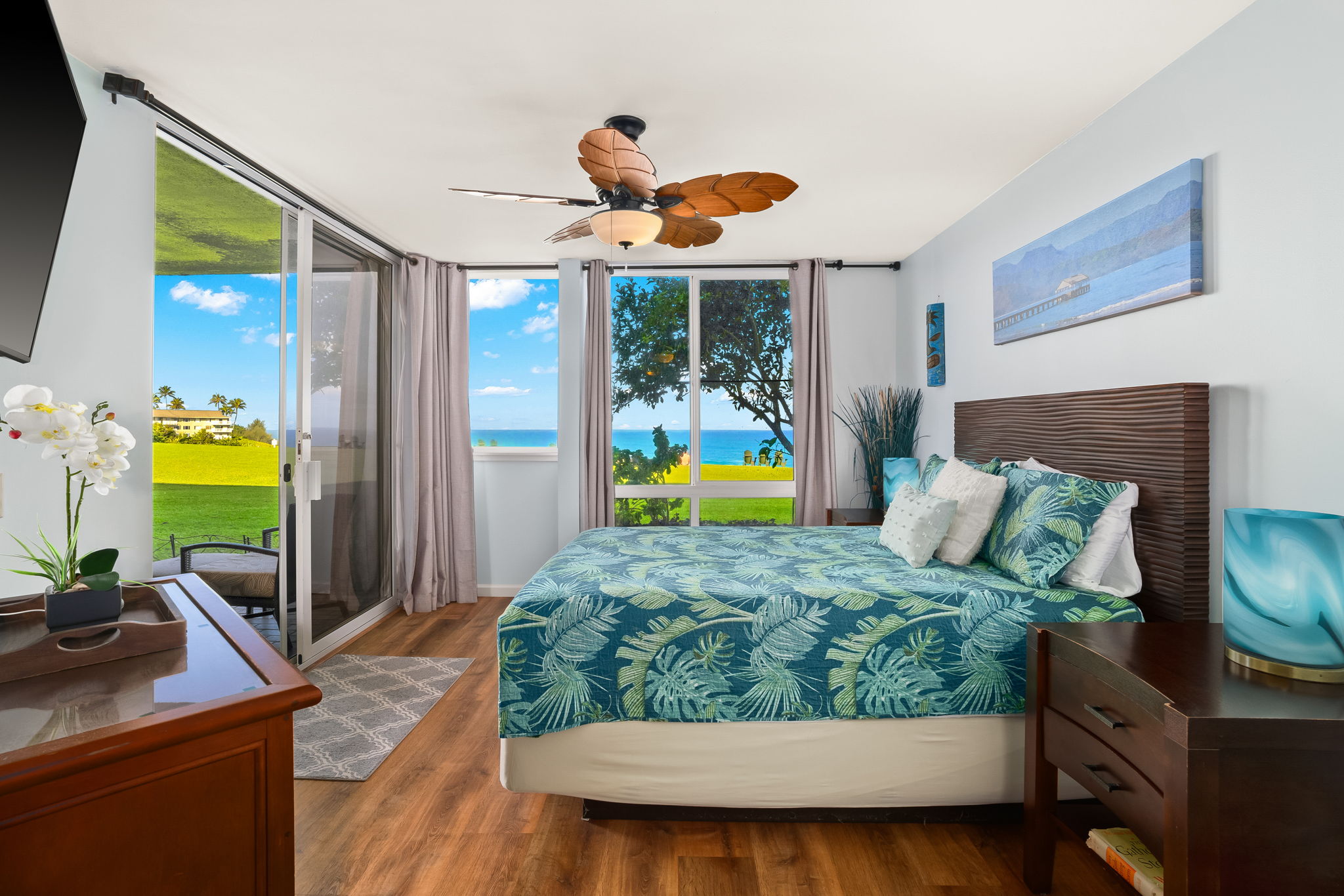 3811 Edward Road, Unit 8204 Princeville, HI 96722 - Photo 14 of 29 a bedroom with a bed and a flat screen tv