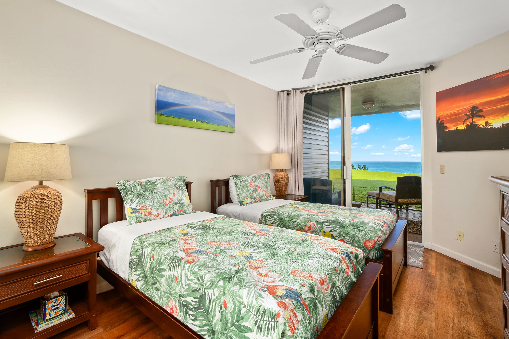 3811 Edward Road, Unit 8204 Princeville, HI 96722 - Photo 16 of 29 a bedroom with a bed and a flat screen tv
