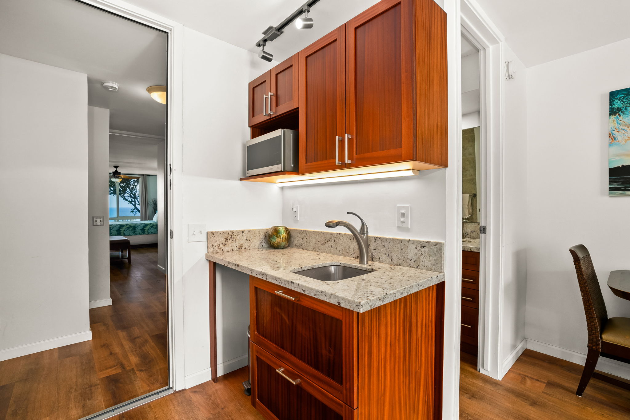 3811 Edward Road, Unit 8204 Princeville, HI 96722 - Photo 19 of 29 a bathroom with a sink and a mirror
