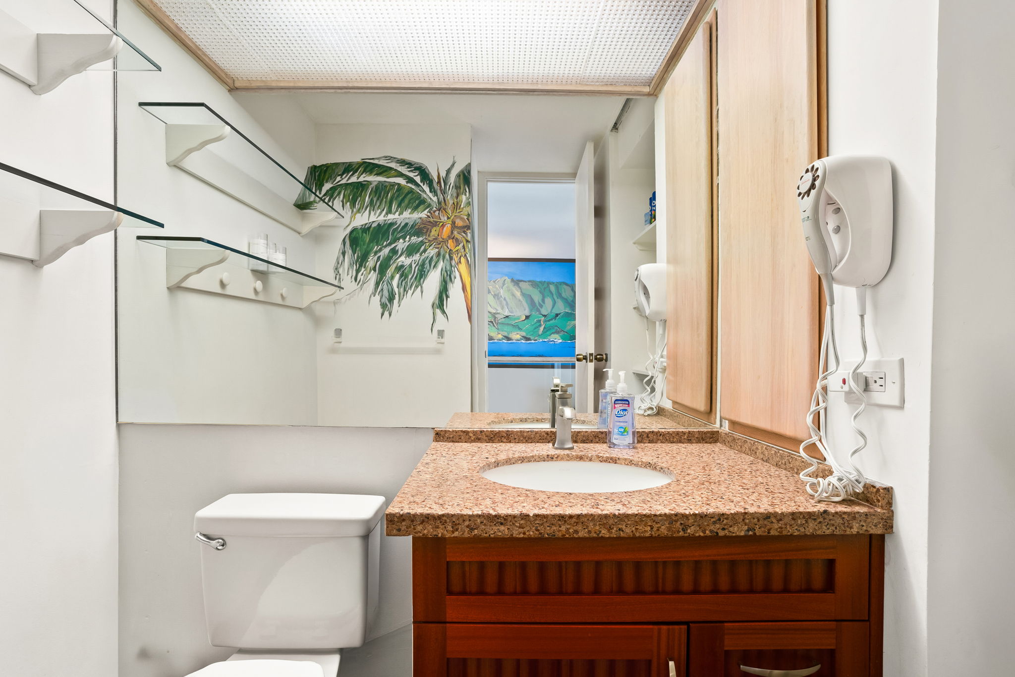 3811 Edward Road, Unit 8204 Princeville, HI 96722 - Photo 8 of 29 a bathroom with a granite countertop sink a toilet and a mirror