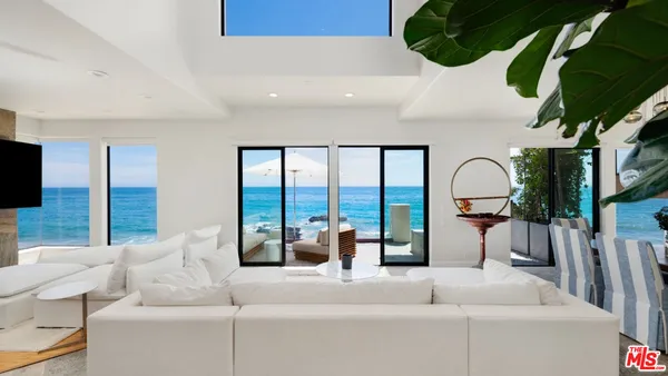 a living room with furniture fireplace and flat screen tv
