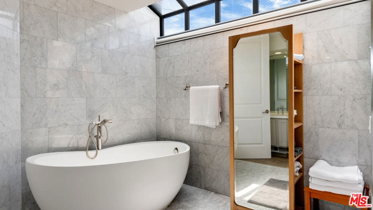 25252 Malibu Road, Unit UPPR Malibu, CA 90265 - Photo 12 of 27 a white bath tub sitting next to a white sink