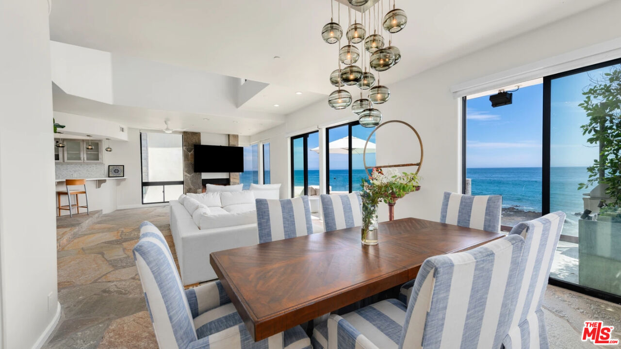 25252 Malibu Road, Unit UPPR Malibu, CA 90265 - Photo 15 of 27 a view of a dining room with furniture window and wooden floor