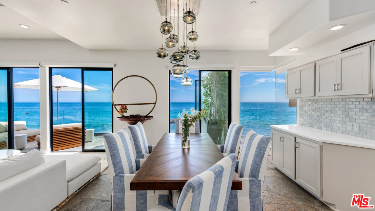 25252 Malibu Road, Unit UPPR Malibu, CA 90265 - Photo 18 of 27 a view of a dining room with furniture window and wooden floor