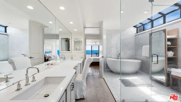 a large room with a lot of white furniture