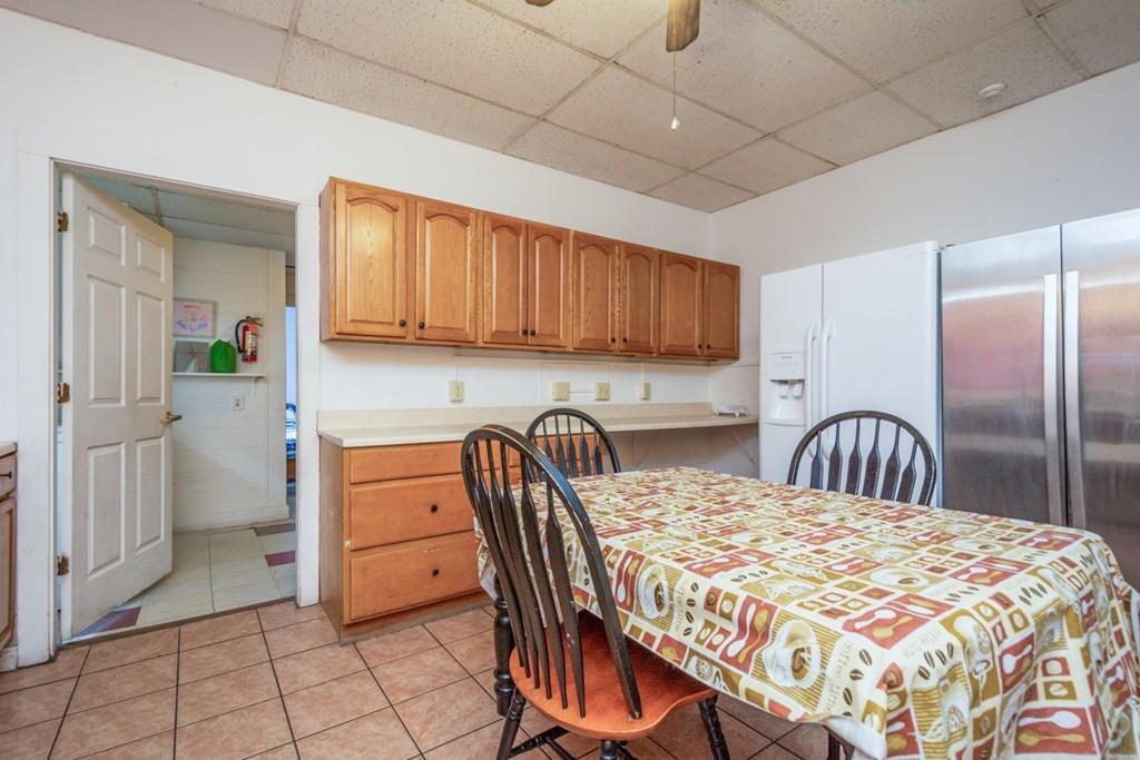 67 Congress Street Fitchburg, MA 01420 - Photo 11 of 39 a kitchen with stainless steel appliances granite countertop a table chairs sink and cabinets