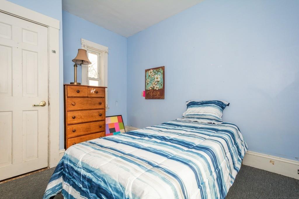 67 Congress Street Fitchburg, MA 01420 - Photo 18 of 39 a bedroom with a bed and a closet