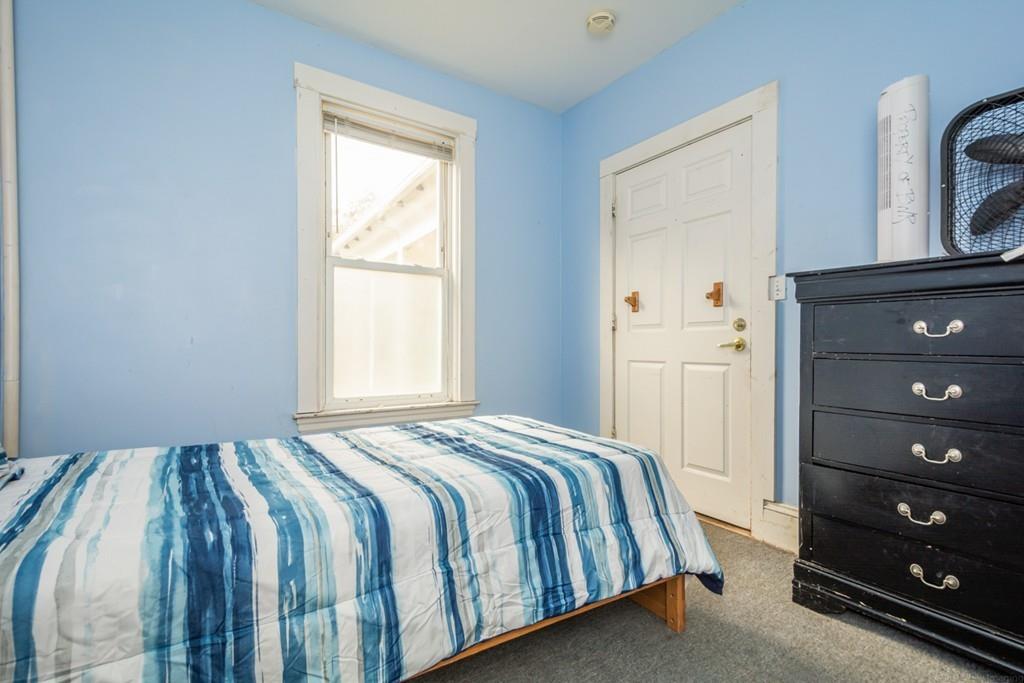 67 Congress Street Fitchburg, MA 01420 - Photo 19 of 39 a bedroom with a bed and a window