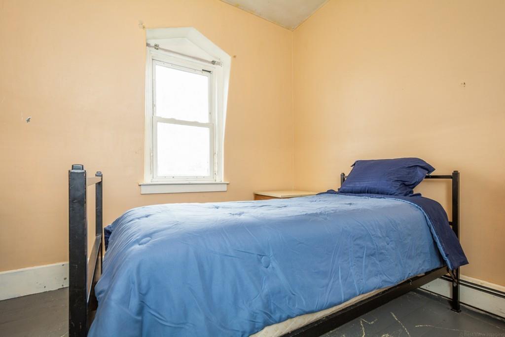 67 Congress Street Fitchburg, MA 01420 - Photo 20 of 39 a bedroom with a bed and a window