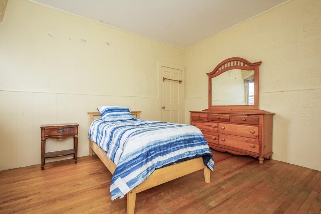 67 Congress Street Fitchburg, MA 01420 - Photo 24 of 39 a bedroom with a bed and a dresser