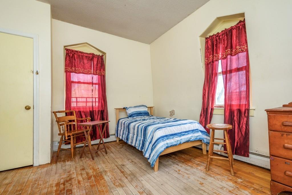 67 Congress Street Fitchburg, MA 01420 - Photo 28 of 39 a bedroom with a bed and a window