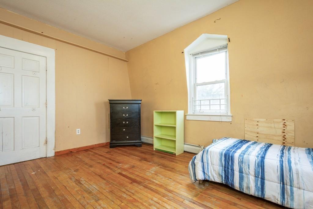 67 Congress Street Fitchburg, MA 01420 - Photo 31 of 39 a bedroom with a bed and a window