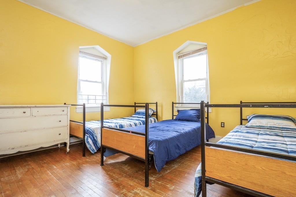 67 Congress Street Fitchburg, MA 01420 - Photo 33 of 39 a bedroom with a bed and window