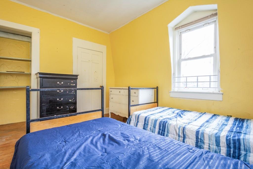 67 Congress Street Fitchburg, MA 01420 - Photo 35 of 39 a bedroom with a bed dresser and a window