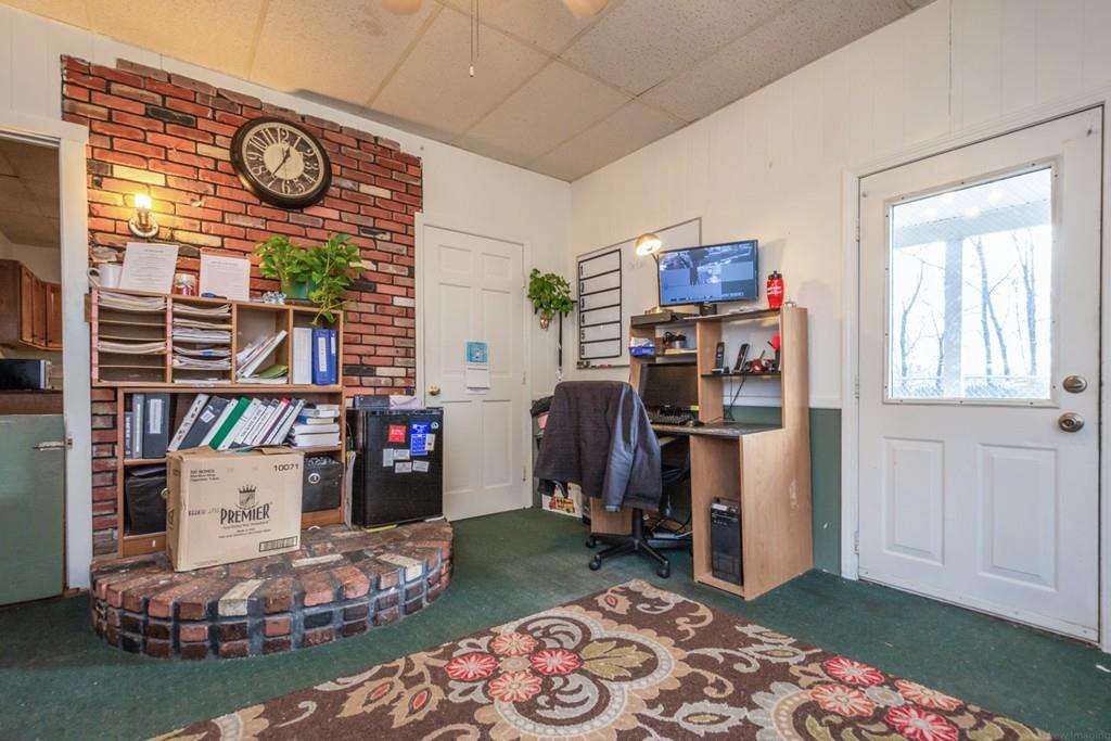 67 Congress Street Fitchburg, MA 01420 - Photo 7 of 39 a living room with lots of furniture and a wooden floor