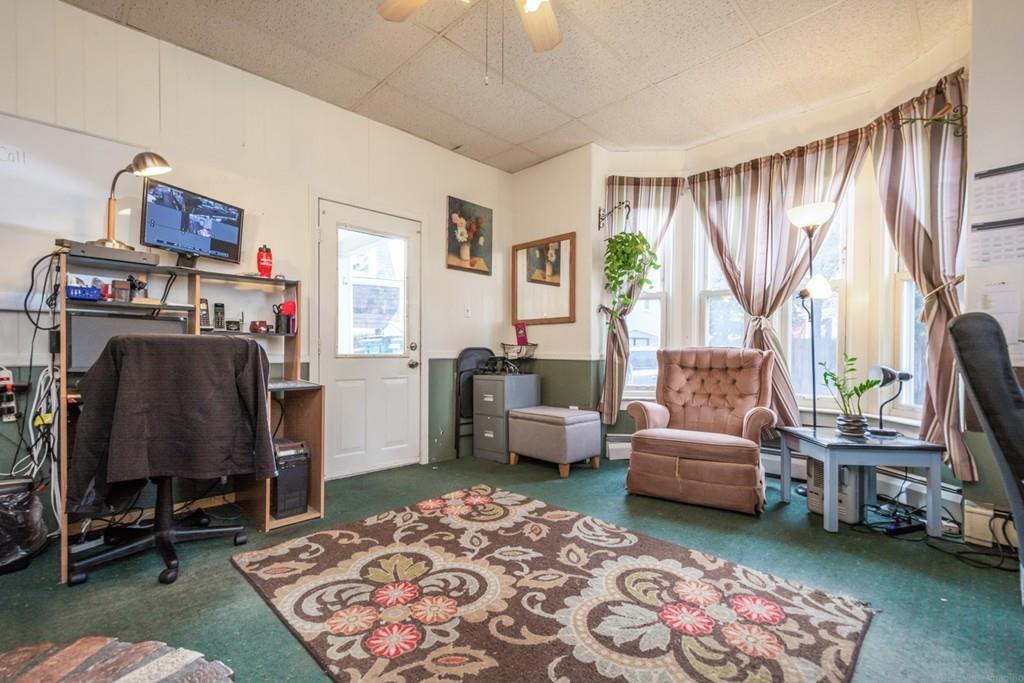 67 Congress Street Fitchburg, MA 01420 - Photo 8 of 39 a living room with furniture and a window
