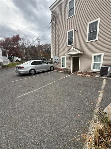 a view of street with parked cars