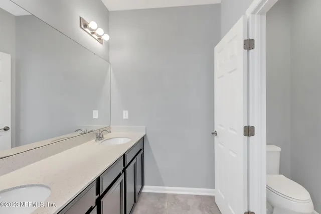 a view of a hardwood & staircase in a room