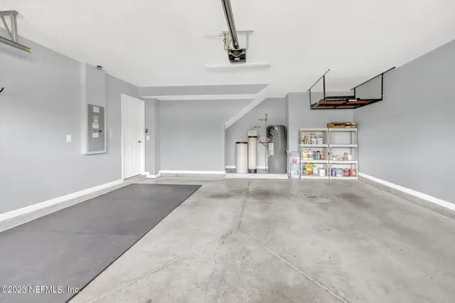 an aerial view of a house with a lake view