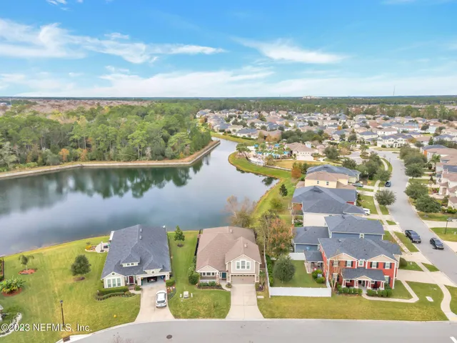 a view of residential houses with a lake view