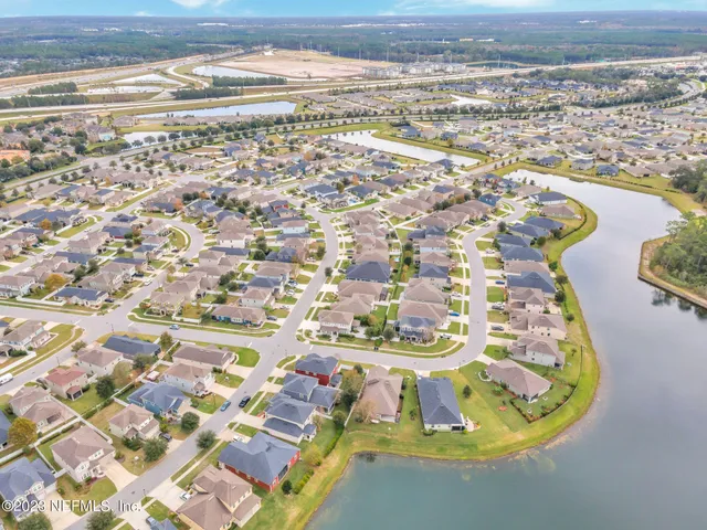 a view of house with outdoor space and swimming pool
