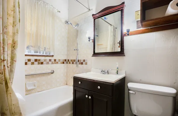 a bathroom with a sink a toilet and a bathtub