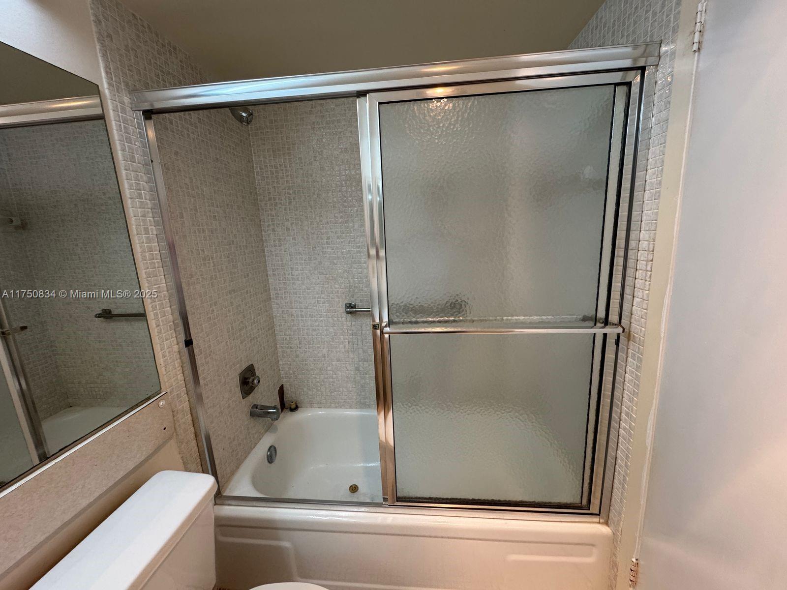 310 Preston H, Unit 310 Boca Raton, FL 33434 - Photo 11 of 21 a bathroom with a bathtub and a shower