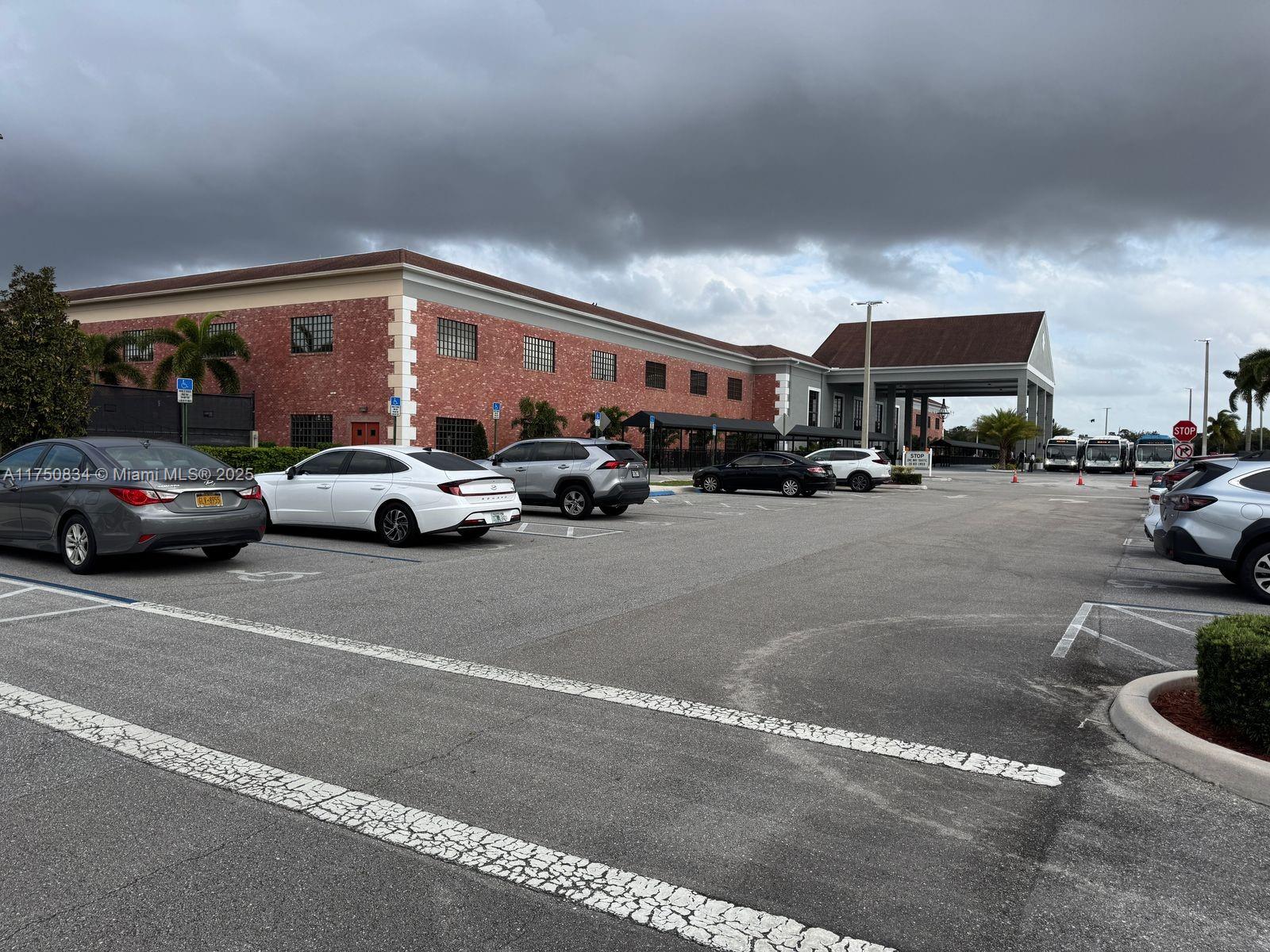 310 Preston H, Unit 310 Boca Raton, FL 33434 - Photo 18 of 21 a car parked in front of a building