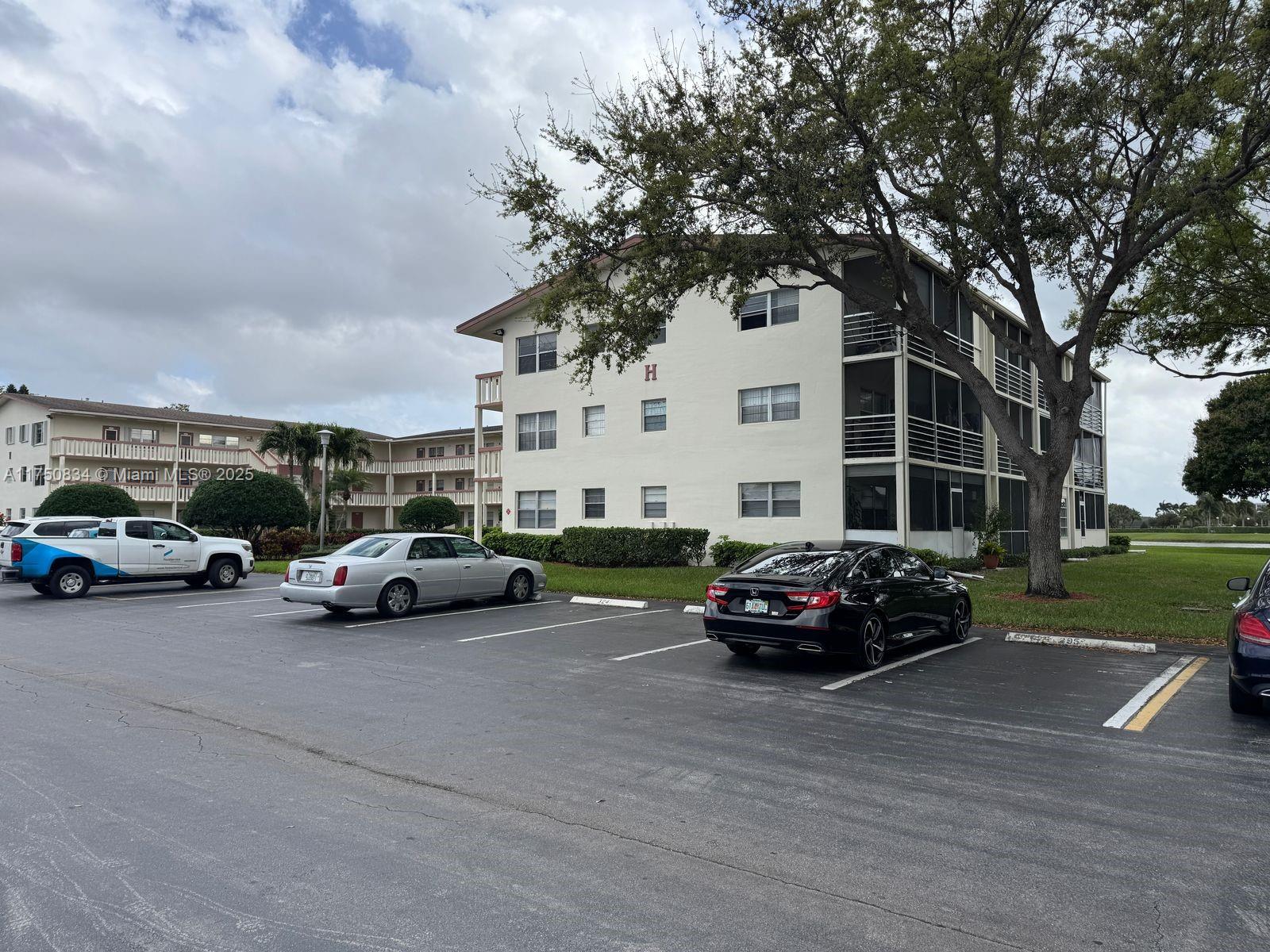 310 Preston H, Unit 310 Boca Raton, FL 33434 - Photo 2 of 21 a car parked in front of a house