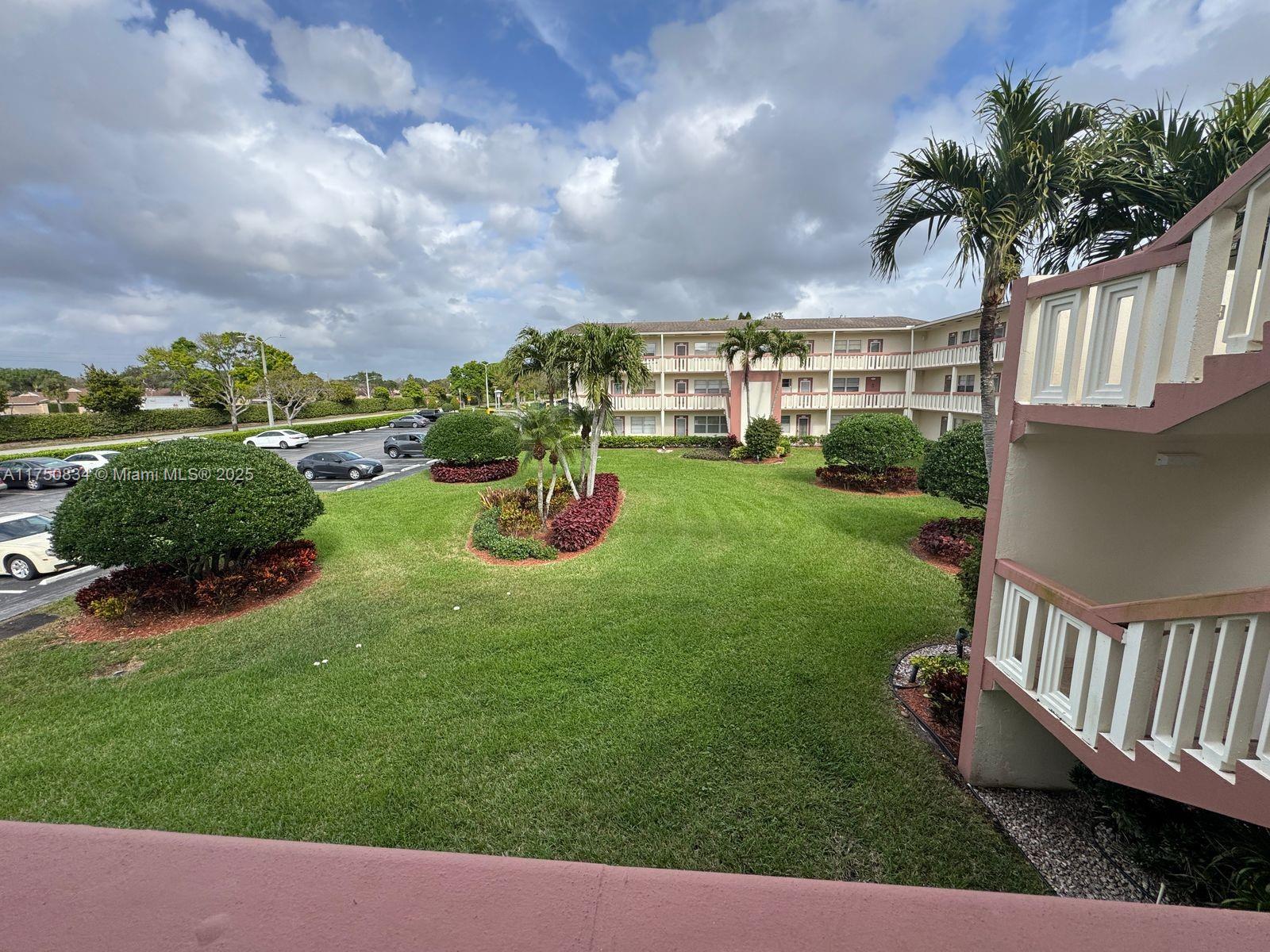 310 Preston H, Unit 310 Boca Raton, FL 33434 - Photo 4 of 21 a view of a porch with furniture and garden