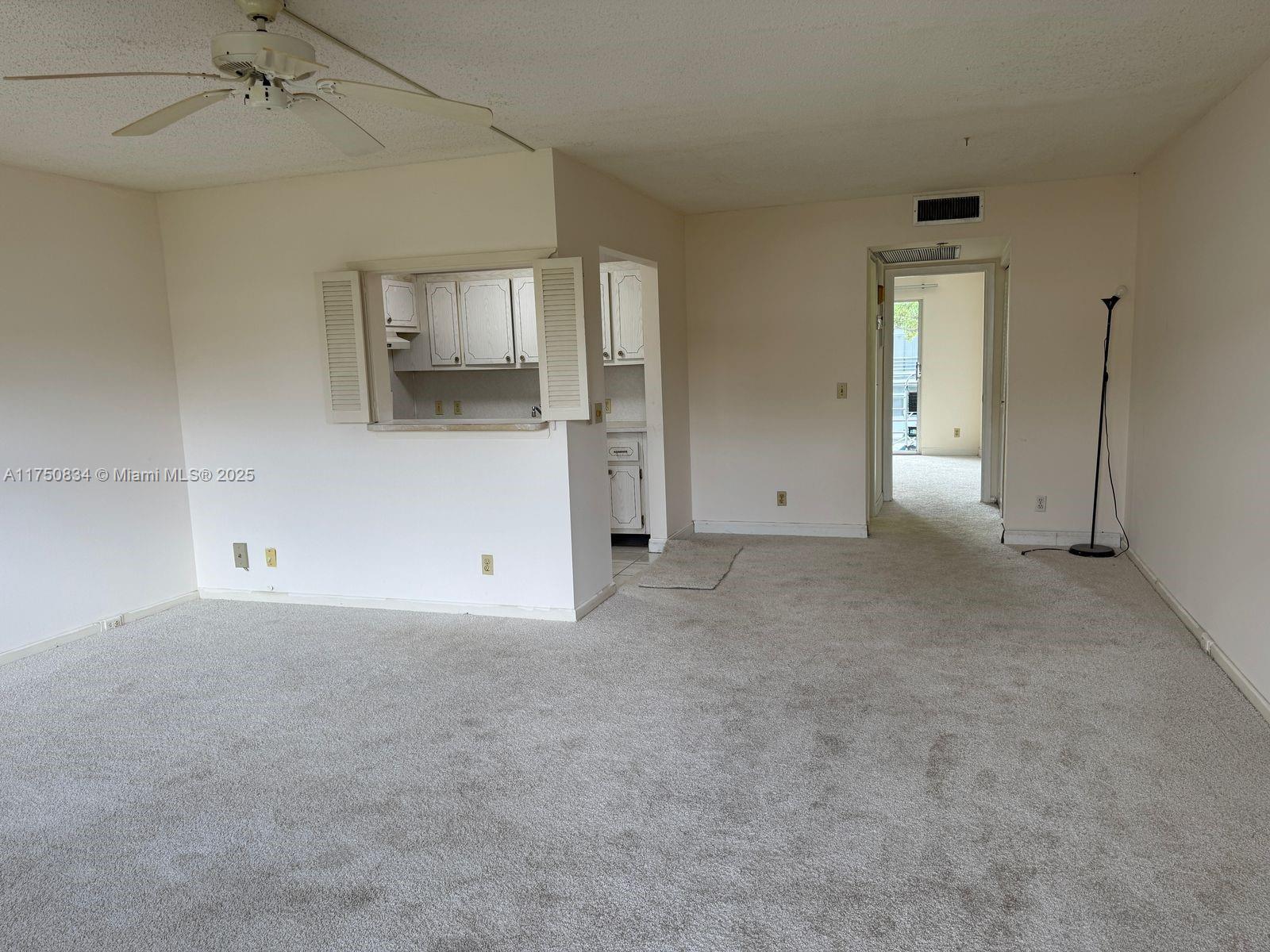 310 Preston H, Unit 310 Boca Raton, FL 33434 - Photo 5 of 21 an empty room with a empty space and windows