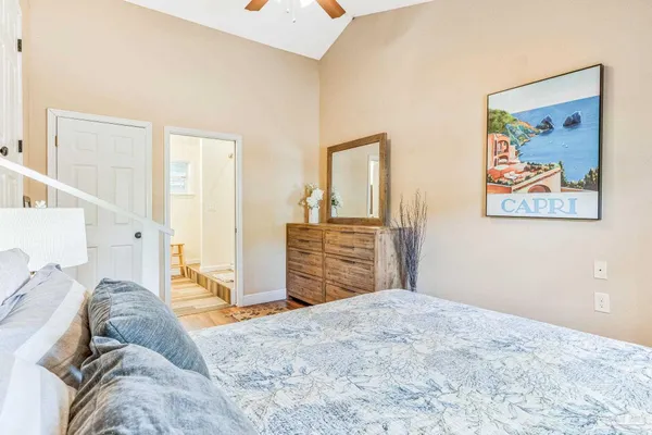 a view of a bedroom with a large bed and closet