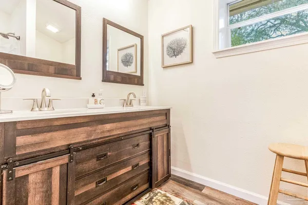 a bathroom with a sink and a mirror