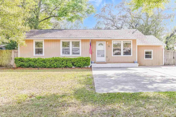 front view of a house with a yard