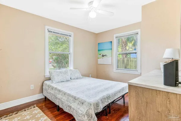 a bedroom with a bed and a dresser