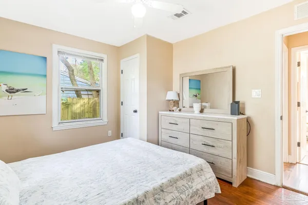 a bedroom with a bed and a mirror
