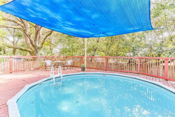 a view of a swimming pool with a patio