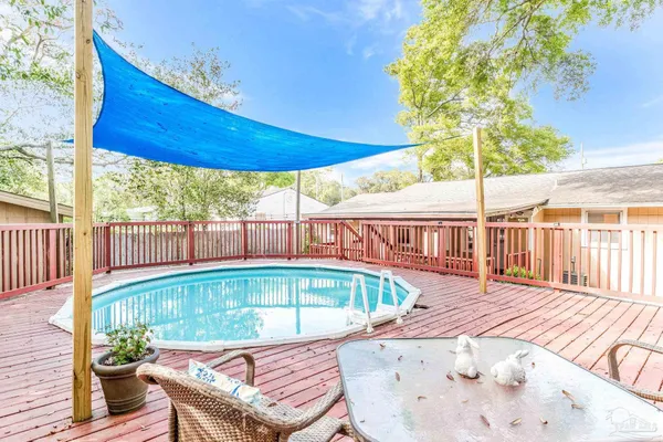 a view of a swimming pool with a patio