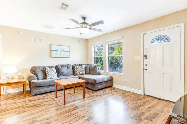 a living room with furniture and a window