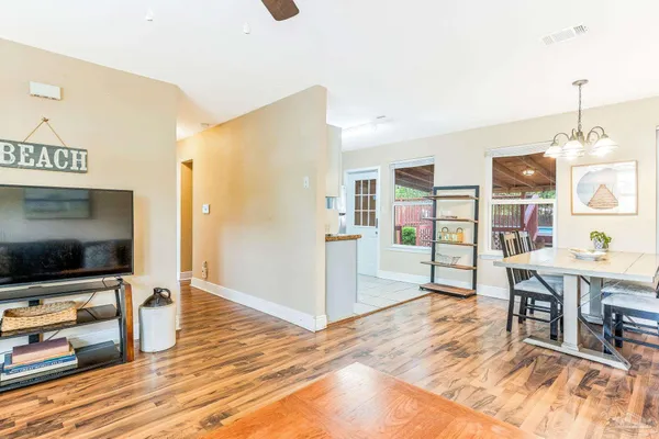 a view of a livingroom with furniture and an empty room