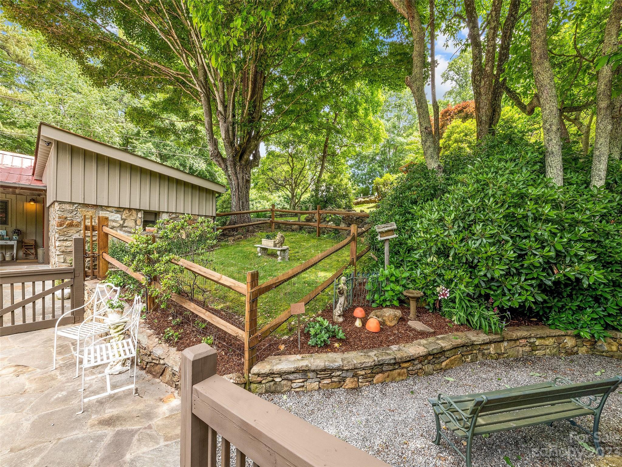 404 Red Bank Road Waynesville, NC 28786 - Photo 9 of 44 a view of a backyard with wooden fence