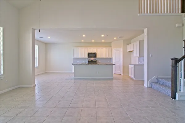 a view of a kitchen with a sink and cabinets