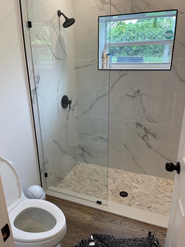 7360 San Sebastian Drive Boca Raton, FL 33433 - Photo 13 of 27 a bathroom with a sink a toilet and shower