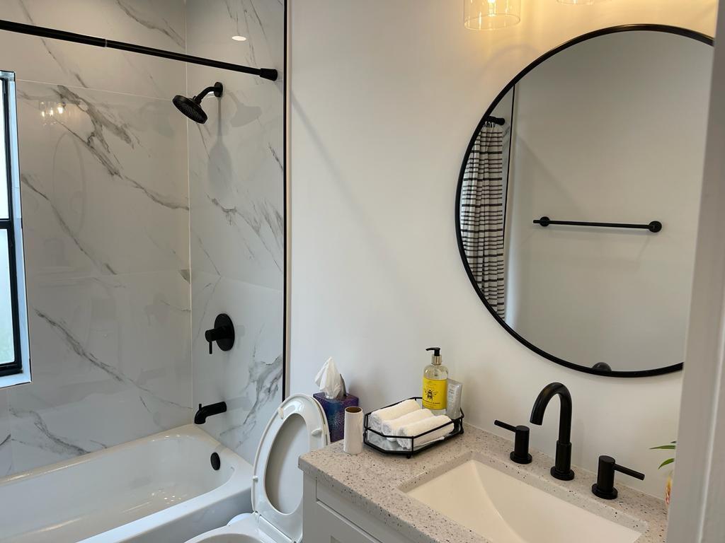 7360 San Sebastian Drive Boca Raton, FL 33433 - Photo 14 of 27 a bathroom with a sink and a mirror