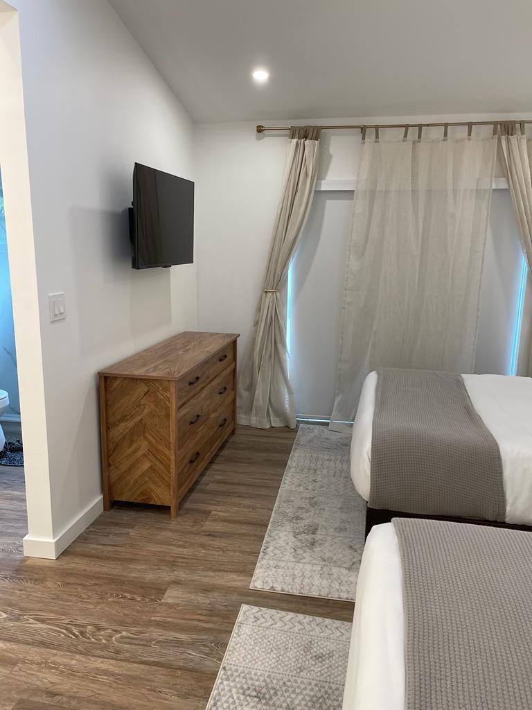 7360 San Sebastian Drive Boca Raton, FL 33433 - Photo 18 of 27 a living room with furniture and a flat screen tv